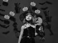 Halloween party and decorations concept. Girl with interested face