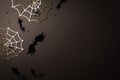 Halloween party decorations at night from bats, spider web and confetti top view. Happy halloween minimal holiday greeting card Royalty Free Stock Photo