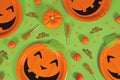 Halloween party flat lay with orange pumpkin paper plates, witch brooms, confetti and Happy Halloween text Royalty Free Stock Photo