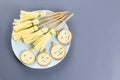 Halloween party food. Cheese witches brooms and ghost faces on a plate, top view