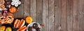 Halloween party food corner border over a rustic wood background with copy space Royalty Free Stock Photo