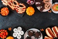 Halloween party food double border over a black stone background Royalty Free Stock Photo