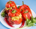 Halloween party food. Red stuffed peppers with scary cutout faces close up Royalty Free Stock Photo