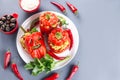 Halloween party food. Red stuffed peppers with scary cutout faces close up Royalty Free Stock Photo