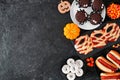 Halloween party food side border over a black stone background with copy space Royalty Free Stock Photo
