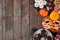 Halloween party food side border over a rustic wood background with copy space Royalty Free Stock Photo