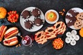 Halloween party food table scene top view over a black stone background Royalty Free Stock Photo