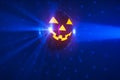 Halloween party pumpkin disco ball, blue shiny rays background Royalty Free Stock Photo