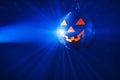 Halloween party pumpkin disco ball, blue shiny rays background