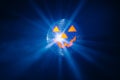 Halloween party pumpkin disco ball, blue shiny rays background