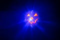 Halloween party pumpkin disco ball, jack o'lantern with shiny rays in smoke Royalty Free Stock Photo