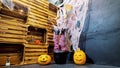 Halloween party, scenery in the style of Halloween with pumpkins, cobwebs. in a cauldron, a pot, women's legs stick