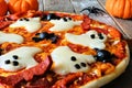 Halloween pizza with ghosts and spiders, close up