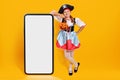 Halloween. Portrait of a child in a carnival costume of a pirate in the studio on a yellow background. Royalty Free Stock Photo