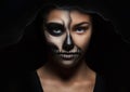 Halloween portrait of young beautiful girl in a black hood. skeleton makeup Royalty Free Stock Photo