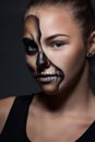 Halloween. Portrait of young beautiful girl with make-up skeleton Royalty Free Stock Photo