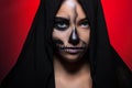Halloween. Portrait of a young beautiful girl with skeleton makeup on her face. Royalty Free Stock Photo