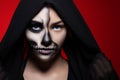 Halloween. Portrait of a young beautiful girl with skeleton makeup on her face. Royalty Free Stock Photo