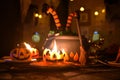 Halloween postcard, witch cauldron cake and pumpkin shape candle with open fire