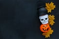 Halloween preparation. Decorative orange lantern pumpkins stay on a grunge background.