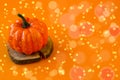 Halloween. Pumpkin and bright lights on an orange background. Decor for a terrible holiday. Decoration concept for Halloween. Copy Royalty Free Stock Photo