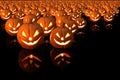 Halloween pumpkin with burning candles on black background Royalty Free Stock Photo