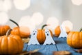 Halloween pumpkin with candlelight and bokeh background. A rustic autumn still life with pumpkins. Bright sunlight coming in from Royalty Free Stock Photo