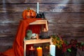 Halloween pumpkin, candles, mushrooms, berries and orange blanket.