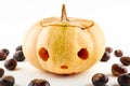 Halloween Pumpkin And Chestnuts On White Background