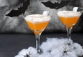 Halloween Pumpkin Cocktail, Toxic Orange Drink Decorated with Spiders, Cobweb and Black Bats on Dark Background Royalty Free Stock Photo