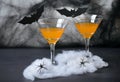 Halloween Pumpkin Cocktail, Toxic Orange Drink Decorated with Spiders, Cobweb and Black Bats on Dark Background Royalty Free Stock Photo