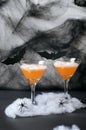 Halloween Pumpkin Cocktail, Toxic Orange Drink Decorated with Spiders, Cobweb and Black Bats on Dark Background Royalty Free Stock Photo