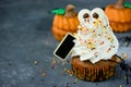 Halloween pumpkin cupcakes with funny meringue ghost, idea for H