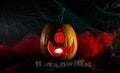 Halloween Pumpkin in dark atmosphere. Creepy smile, horror symbol