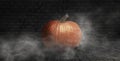 Halloween pumpkin on a dark background with smoke and fog at night Royalty Free Stock Photo