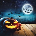 Halloween Pumpkin in a dark mist Forest. Elements of this image furnished by NASA