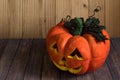 Halloween pumpkin decoration lateral on wooden background. at Night.