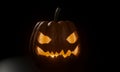 Halloween Pumpkin. The demon`s face had light from inside. The black background and the light shining from the back. 3D Rendering Royalty Free Stock Photo