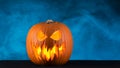 Halloween pumpkin design with blue mist on background. Copy space. Royalty Free Stock Photo