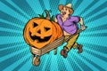 Halloween pumpkin. farmer, man with a wooden wheelbarrow Royalty Free Stock Photo