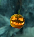 Halloween pumpkin with flame inside on abstract blurred background