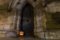 Halloween pumpkin in front of ancient wooden door and stone wall of a church, Germany Royalty Free Stock Photo