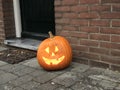 Halloween pumpkin at a front door