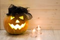 Halloween Pumpkin, funny Jack O'Lantern on wood background Royalty Free Stock Photo