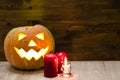 Halloween Pumpkin, funny Jack O'Lantern on wood background Royalty Free Stock Photo