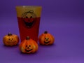 Halloween pumpkin with a glass.