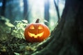 Halloween pumpkin with glowing eyes is in a mystic forest at the night close-up with bokeh background. Jack O Lantern. Generative Royalty Free Stock Photo