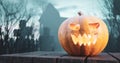 Halloween pumpkin glowing on gothic graveyard Royalty Free Stock Photo