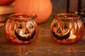 Halloween pumpkin head jack glass lantern. Halloween decoration on wooden table background, selective focus