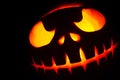 Ghastly Halloween pumpkin head jack lantern on black background